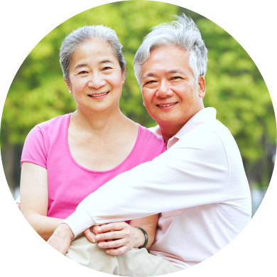 Senior chinese couple relaxing in park together smiling