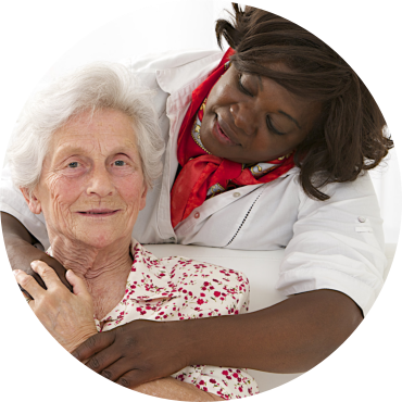 happy senior woman with friendly african american caregiver
